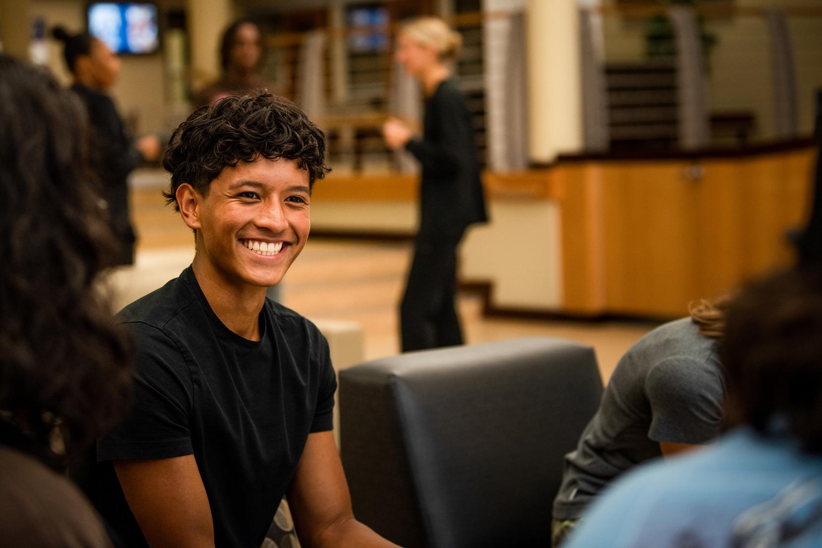 Student sits in the Navigation Station waiting to speak with an advisor